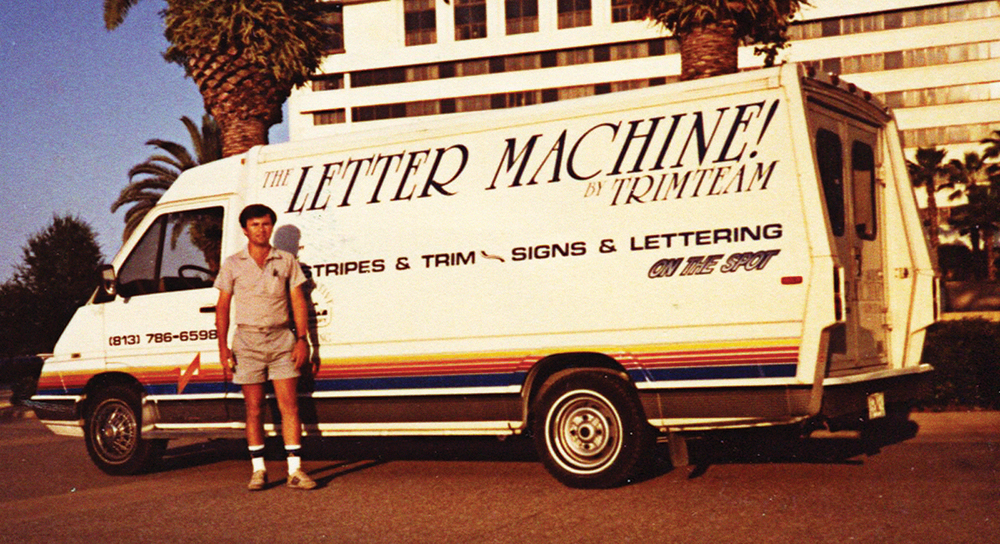Larry Mitchell’s Winnebago cargo utility van — the Sprinter of that era — equipped with shelving for 15-in.-width rolls of vinyl and a Gerber Signmaker IVB plotter with $250 per hard card font. “On the Spot!” lettering and stripes.