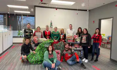 Mactac employees taking a break from volunteering to help with Akron Children’s Hospital ‘Adopt A Family’ gift drive.